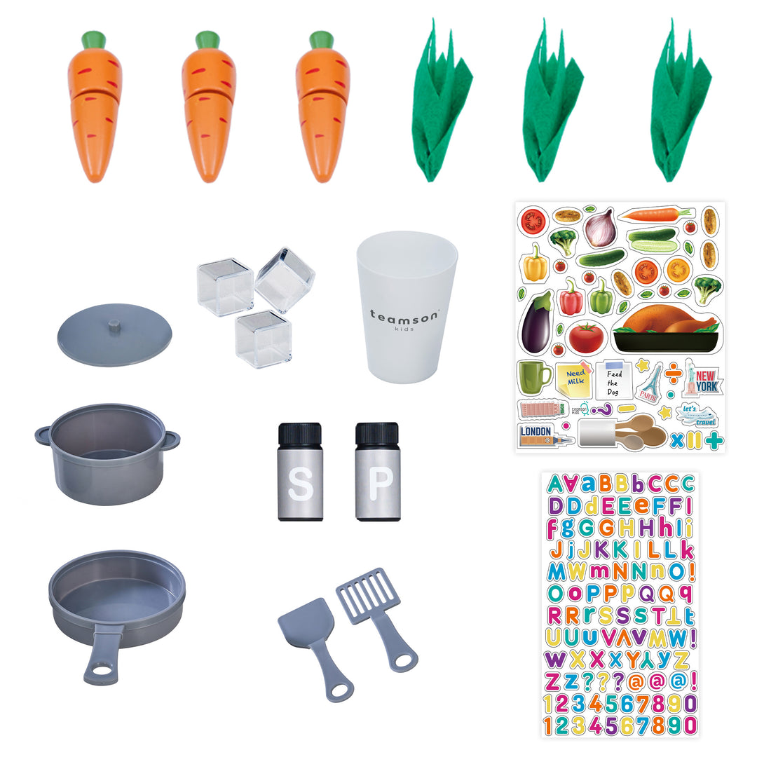 Photo of all the accessories include a salt and pepper shaker, pot, lid, pan, spatula, slotted spatula, cup, and three ice cubes, and reusable stickers for personalization, play carrots that can be cut. 