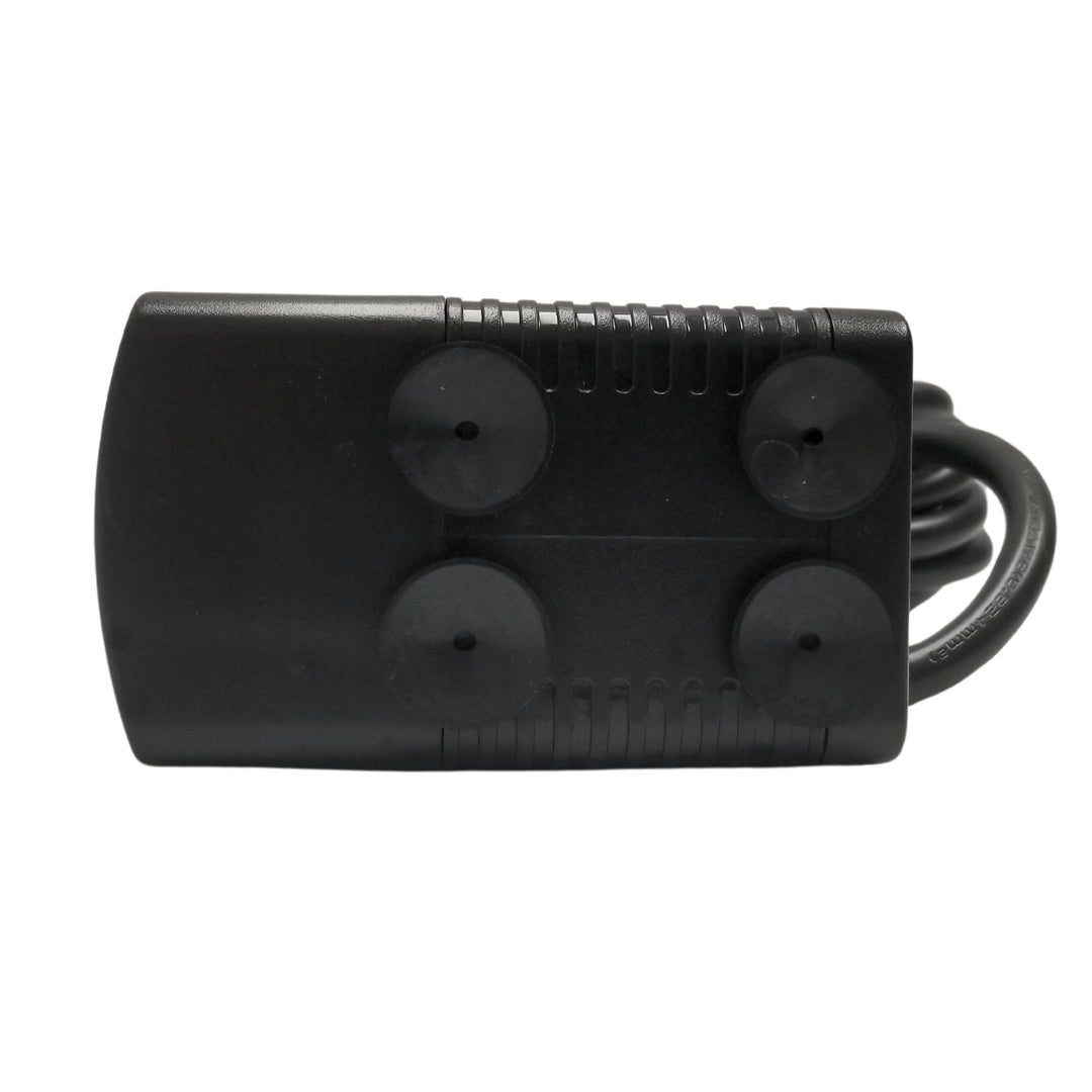 Submersible pump with four round suction cups and attached cable, viewed from above.