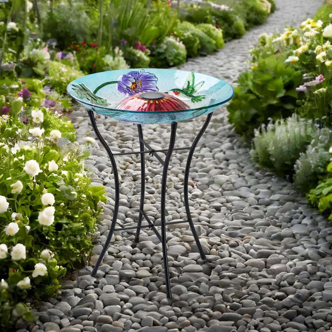 birdbath on a walkway in a garden, day time