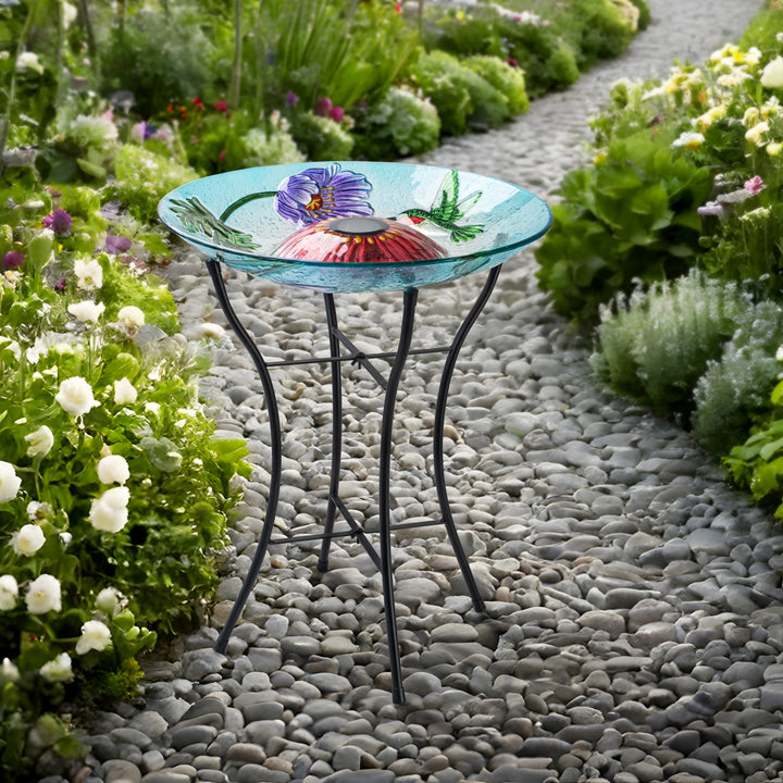 birdbath on a walkway in a garden, day time