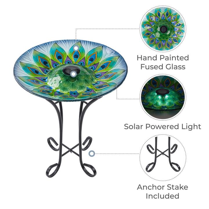 Callout features include the hand painted fused glass bowl, solar-powered central light, and the foldable metal stand with an anchor stake included