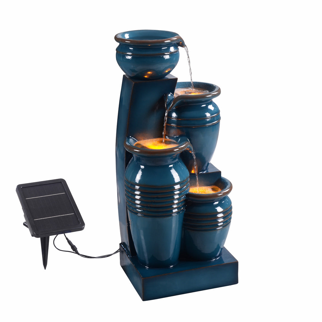 A view from the side showing the top pedestal and solar panel of the Teamson Home 28.74" Blue 4-Tier Outdoor Solar Water Fountain with LED Lights