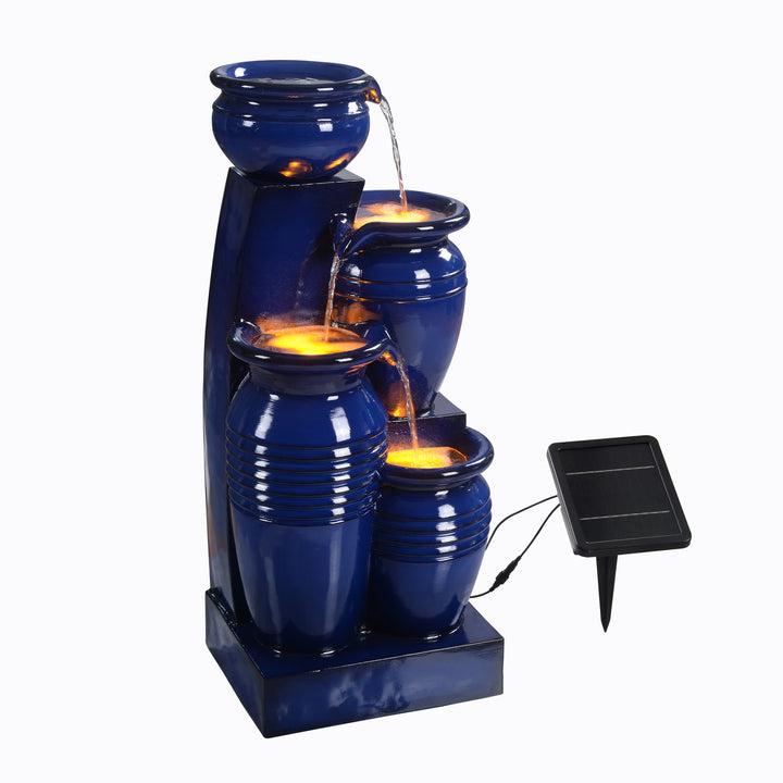 Teamson Home 28.74" Navy Blue 4-Tier Outdoor Solar Water Fountain with LED Lights on underneath the water and the solar panel next to the right