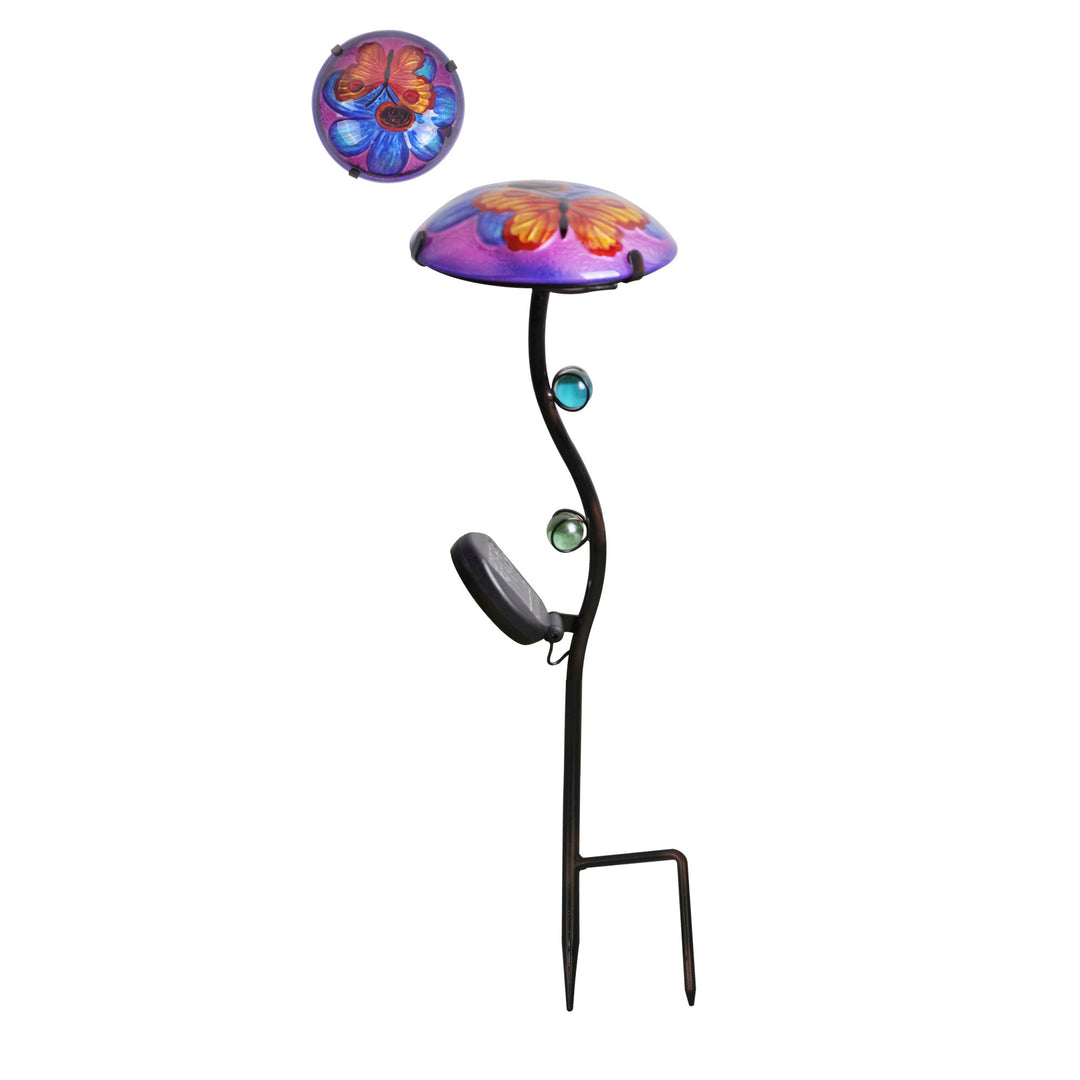 A fusion glass solar-powered LED light stake, purple with a blue flower and red and yellow butterfly