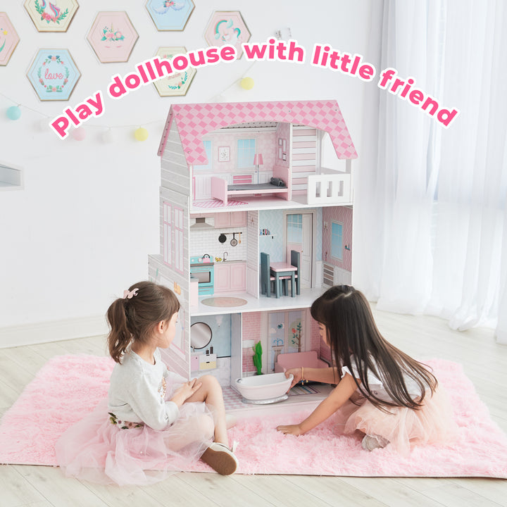 Two children playing with a Teamson Kids Ariel 2-in-1 Double-Sided Play Kitchen with Accessories and Furnished Dollhouse for 12" Dolls in a brightly decorated room.