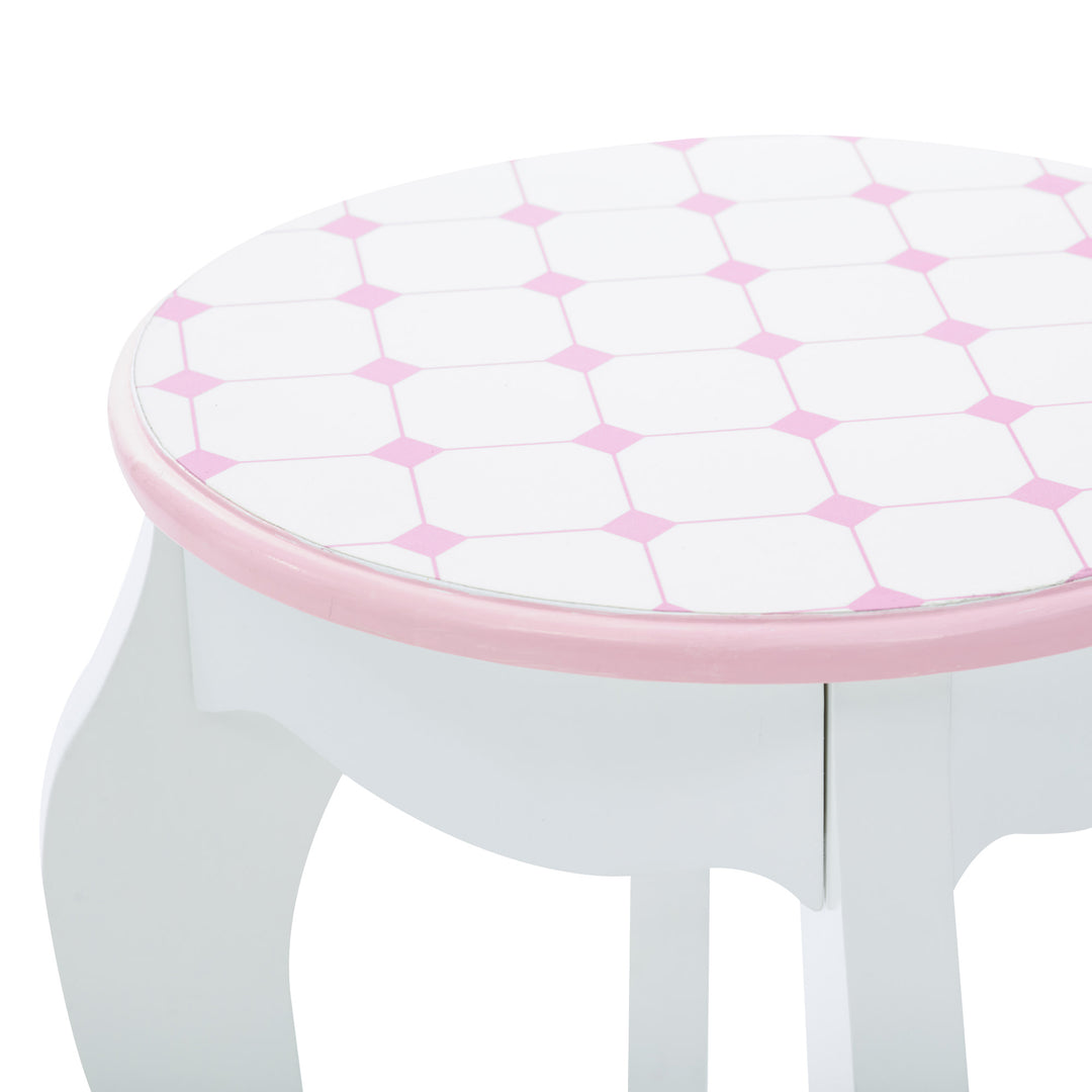 A white and pink stool with a Fantasy Fields Kids Dreamland Castle Vanity Set with Chair and Accessories, White/Pink pattern.