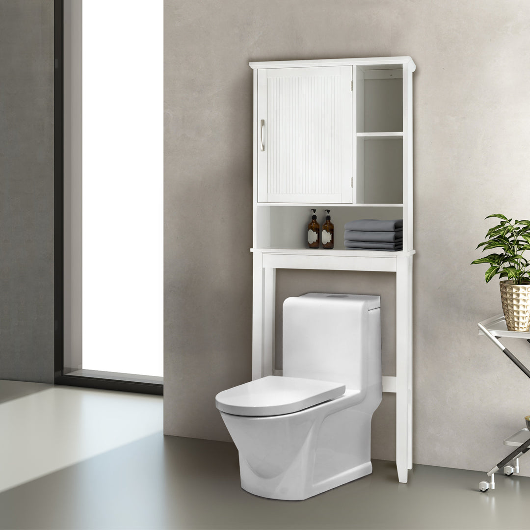 A White Teamson Home Newport Over-the-Toilet Cabinet with open shelving over a sleek toilet in a beige bathroom with large window