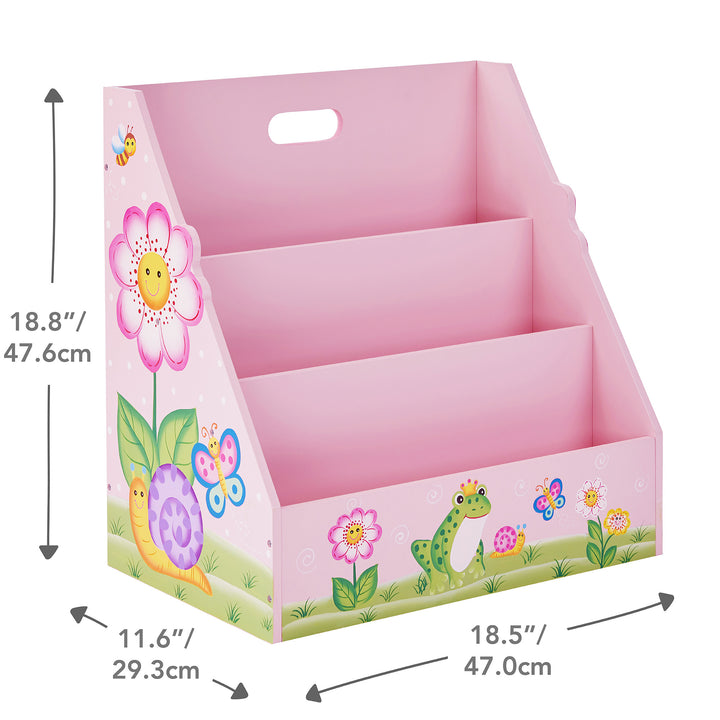 A Fantasy Fields Kids Painted Wooden Magic Garden 3-Tiered Bookshelf, Pink with a frog and flowers on it, designed for a playroom.
