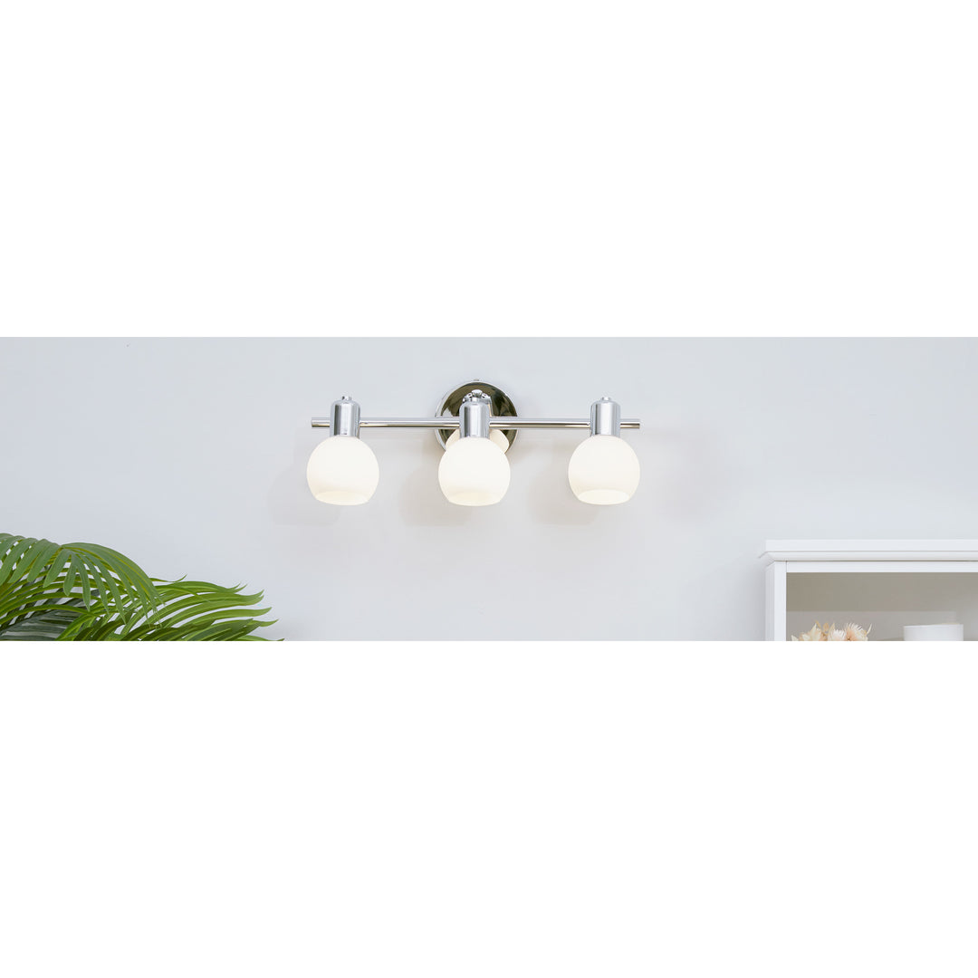 Teamson Home  3-Light Vanity Fixture with Frosted Globe Shades, Chrome in a bathroom