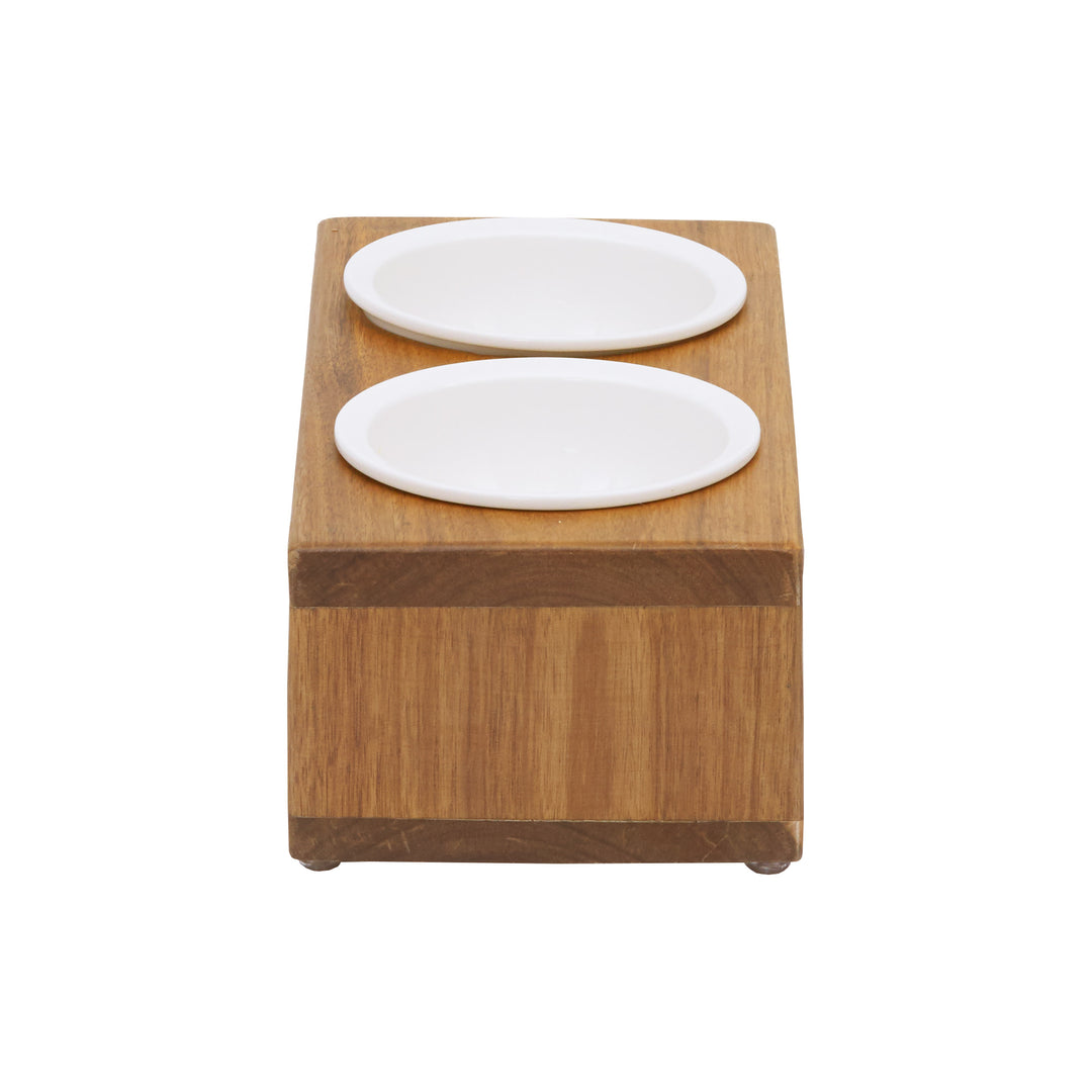 A view from the side of a wood grain finished elevated pet feeder with two removable ceramic bowls.
