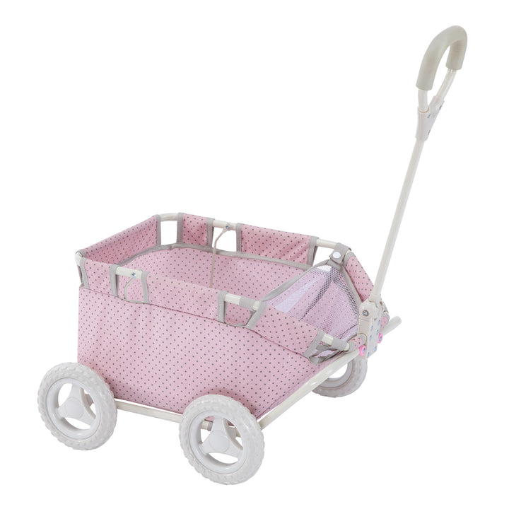 A Olivia's Little World Polka Dots Princess Baby Doll Wagon, Pink with a handle and wheels.