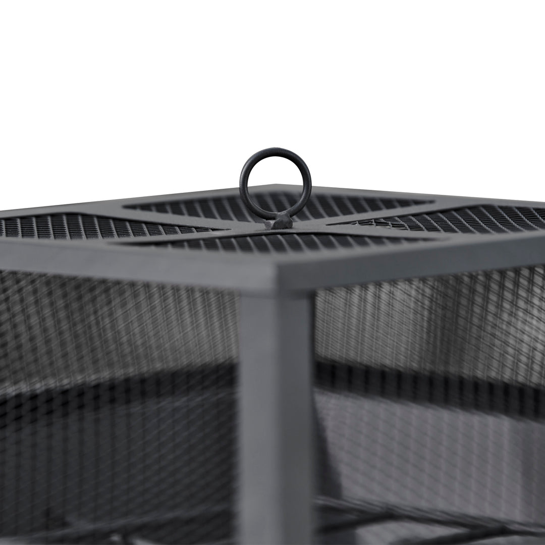 A close-up of the ring on top of the mesh spark screen on the Teamson Home Outdoor 24" Wood Burning Fire Pit with Tabletop and Decorative Base, Black