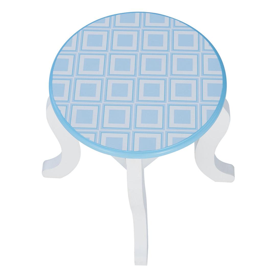 The blue and white pattered seat on the matching stool of the vanity set.