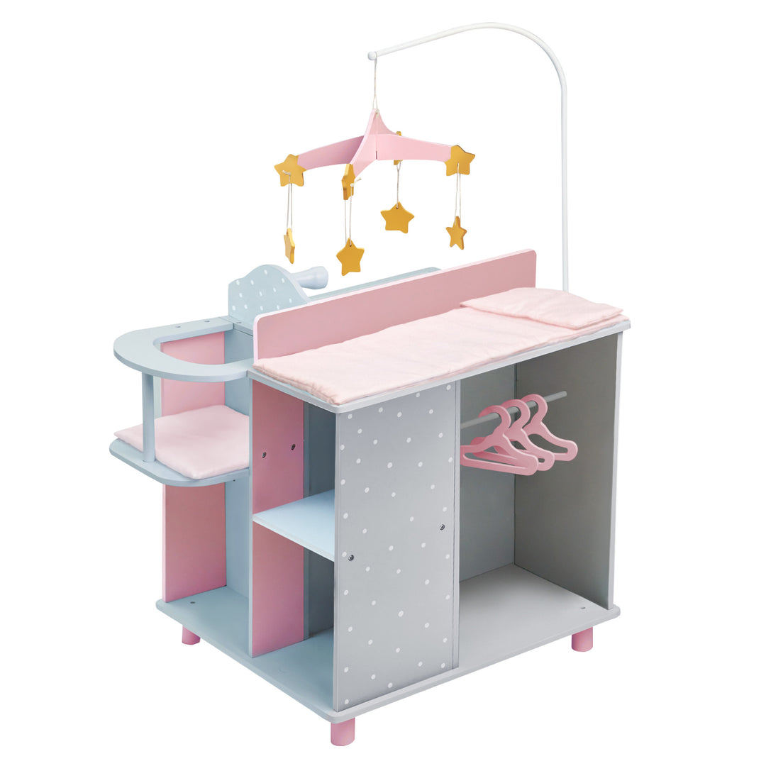 A baby doll changing station in pink and gray with white polka dots with a closet, storage shelves, high chair, mobile, sink, and changing table.