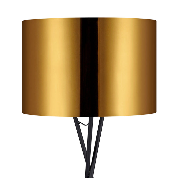 A close-up of the gold metal drum shade