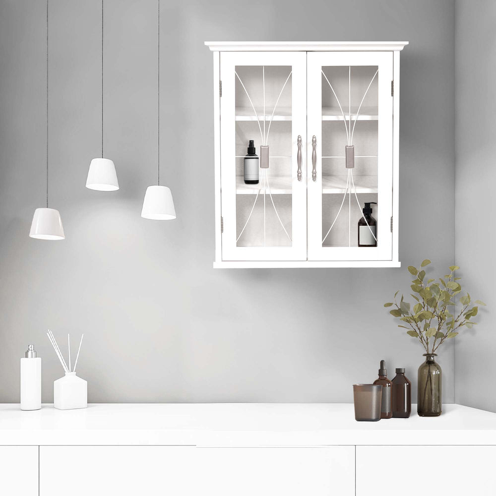 A minimalistic bathroom interior with a Teamson Home White Delaney Removable Wall Cabinet, White hanging pendant lights, and decorative bottles on a countertop.