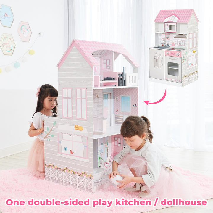 Two children play with a Teamson Kids Ariel 2-in-1 Double-Sided Play Kitchen with Accessories and Furnished Dollhouse for 12" Dolls, Pink, in a bright room.