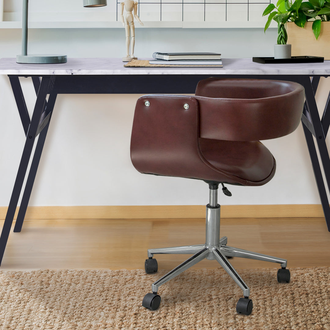 Teamson Home's Faux Brown Leather Mid-Century Modern Adjustable Office Chair rises and features rollers.
