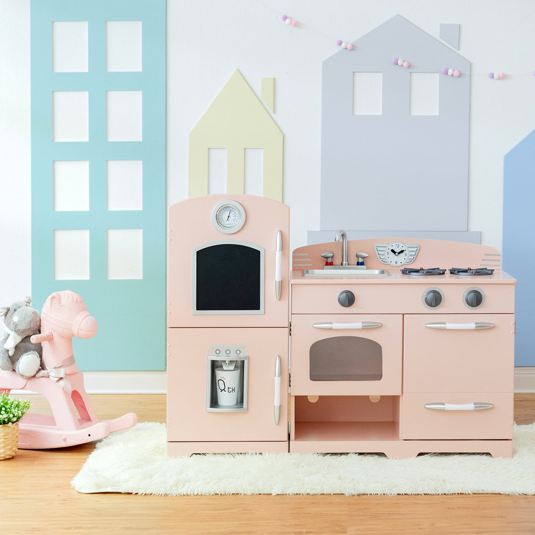 A child's play area featuring the Teamson Kids Little Chef Fairfield Retro Kids Kitchen Playset with Refrigerator, Pink and a rocking horse.