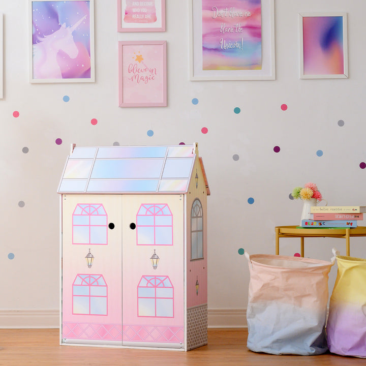 A girl's room with Olivia's Little World Dreamland Glass-Look Dollhouse for 12" Dolls, accessories, and polka dots on the wall.