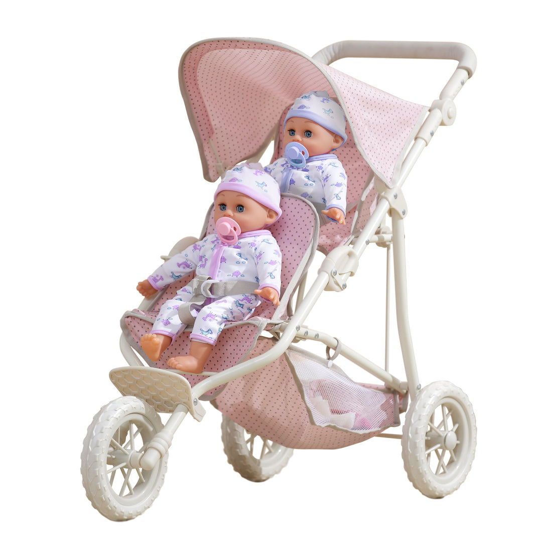 The pink with gray polka dots tandem jogging stroller with a baby doll in the front seat and a baby doll in the back seat.