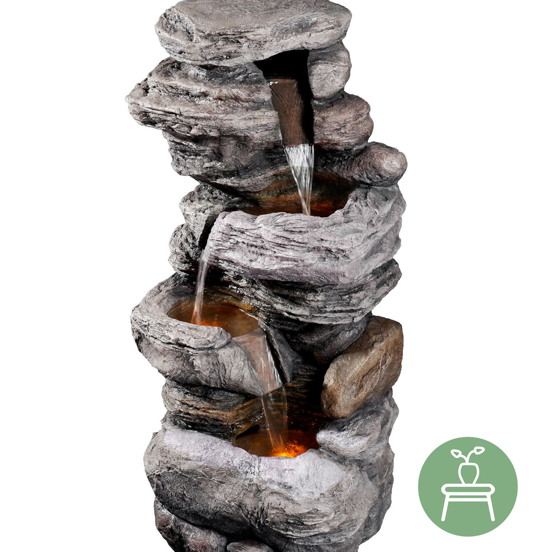 A view of the Teamson Home 4-Tier Stacked Stone Water Fountain with LED Lights, Gray, which can go inside and outside