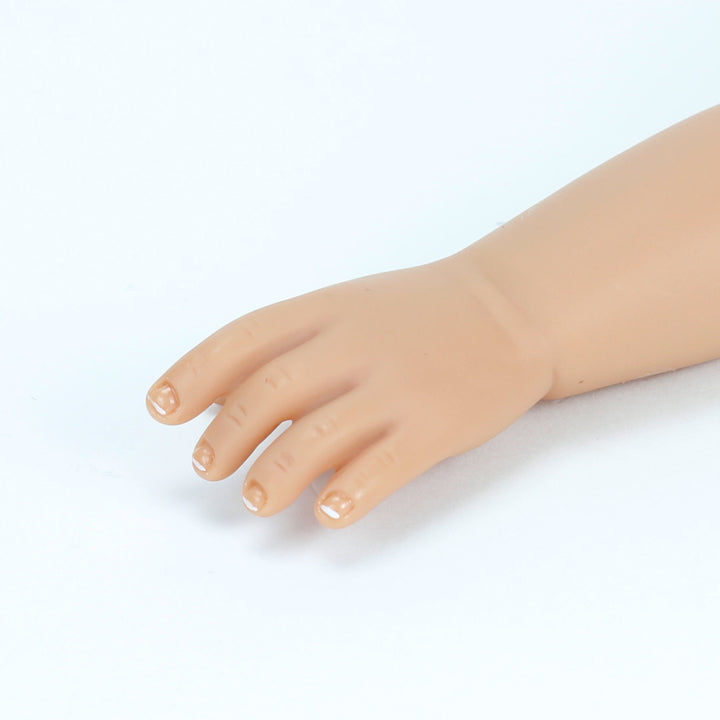 A close-up of the french manicure on the dolls.