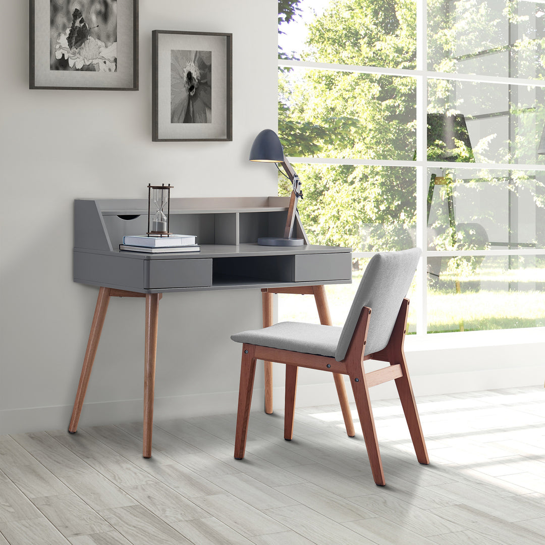 A gray Teamson Home Creativo Wooden Writing Desk with Storage and chair in a room with a window.