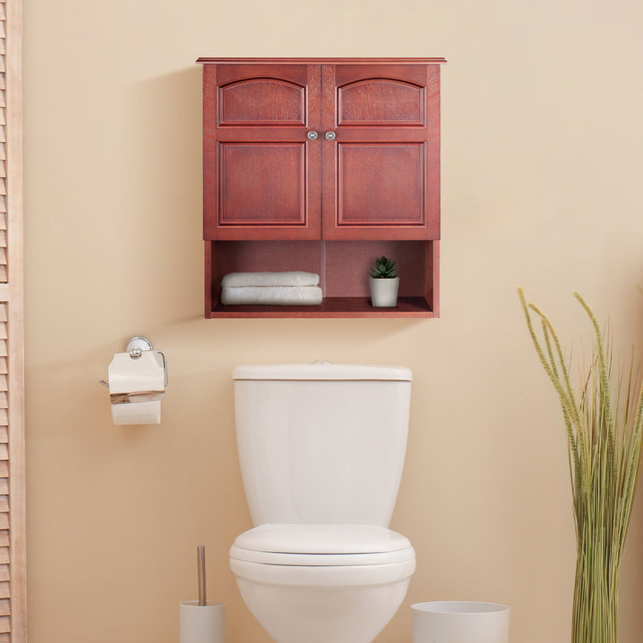 Teamson Home Mahogany Martha Removable Wall Cabinet  mounted above a toilet, next to a toilet paper holder, with towels and a plant inside the cabinet.