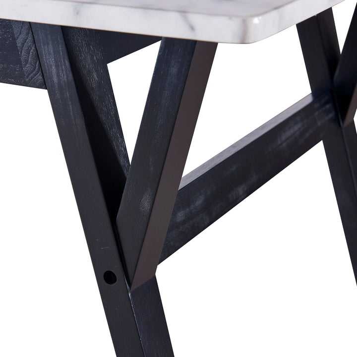 A close-up of the black wood finished table legs