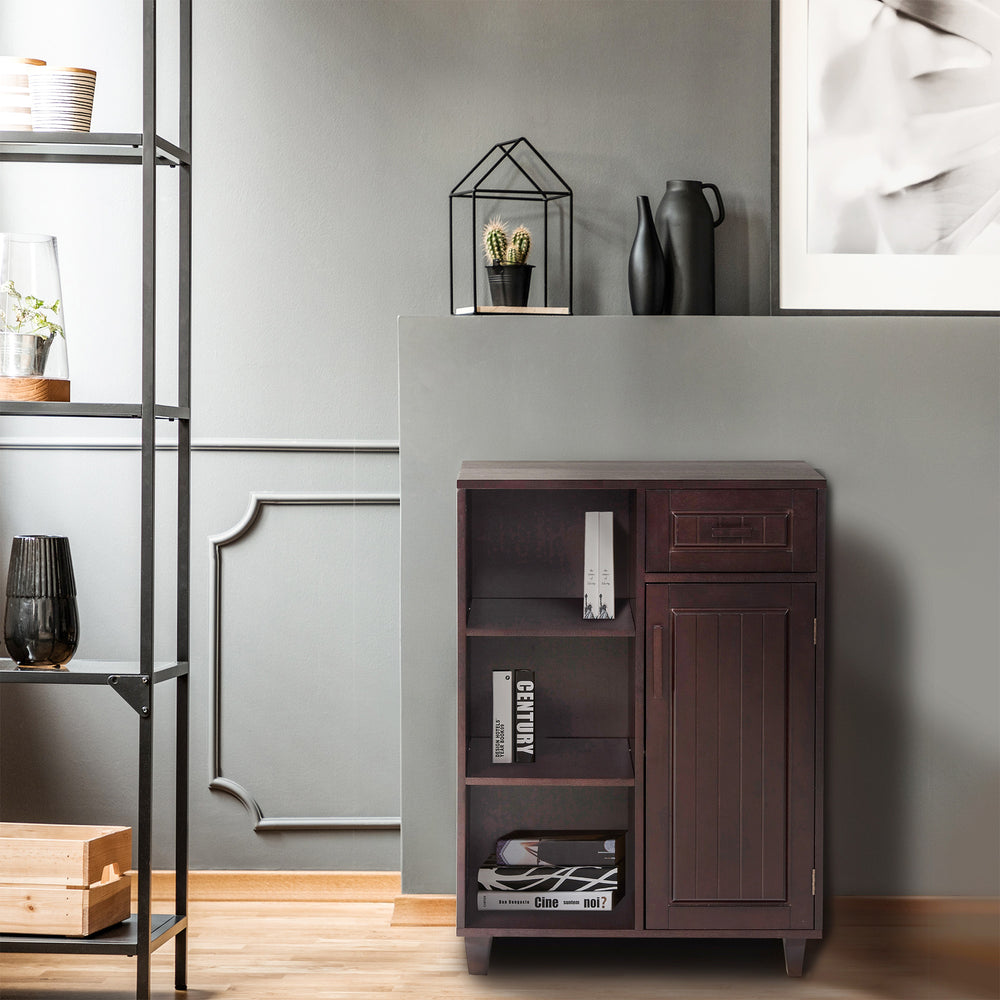 A dark espresso color Teamson Home Catalina Single Door Free Standing Cabinet with Open Shelves and Drawer in a living room.