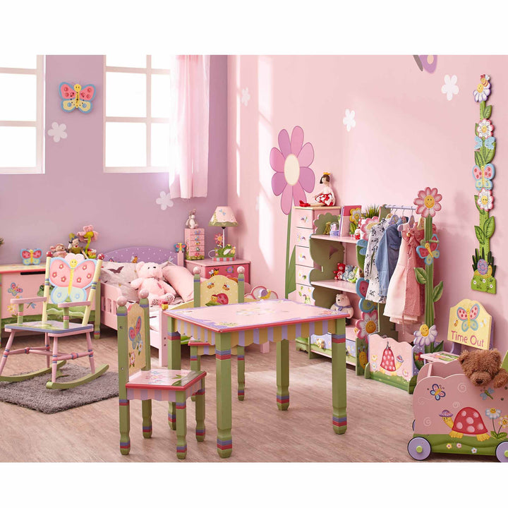 A pink bedroom decorated with themed furnishings featuring butterflies, flowers, turtles, and bright pastel colors including a rocking chair, toy chest, clock, wall hanging, nightstand, table lamp, dresser, wardrobe, bookshelf, trolley.