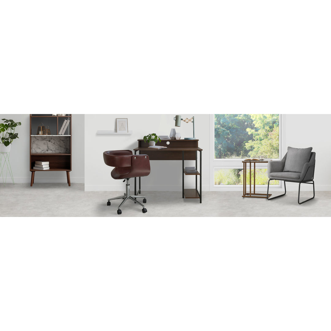 Teamson Home's Faux Brown Leather Mid-Century Modern Adjustable Office Chair, writing desk, and gray accent chair in a modern-looking office.