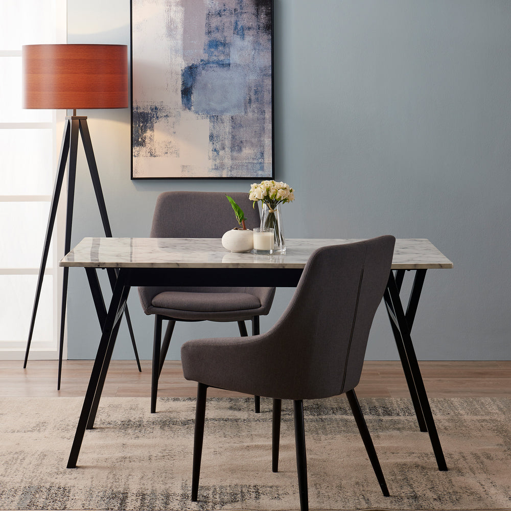 Teamson Home Ashton Dining Table with Black Wood Base and Faux Marble Tabletop flanked by a pair of gray mid-century modern chairs