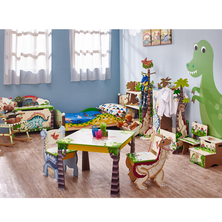 A children's room with a Fantasy Fields Dinosaur Kingdom Bookshelf with Storage Drawer, Multicolor theme.