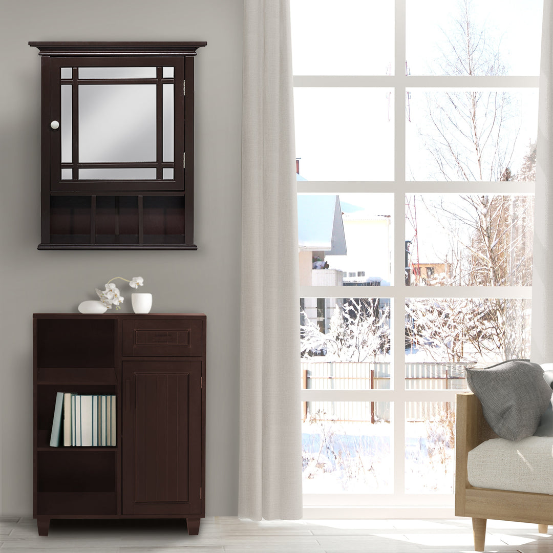 A cozy interior room with a Teamson Home Espresso Neal Mirrored Medicine Cabinet with open shelving next to a large picture window