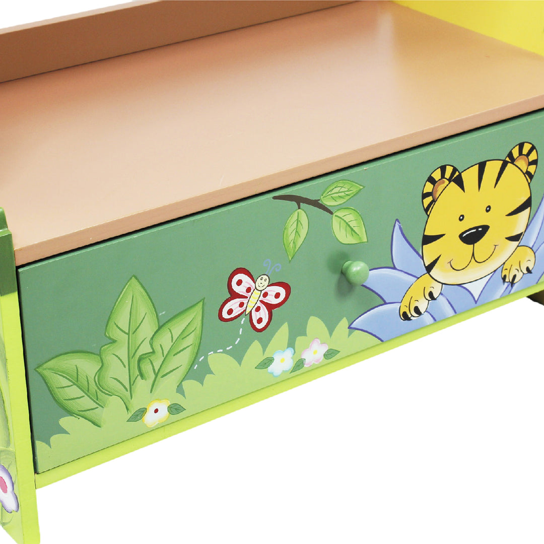 A Fantasy Fields Kids Painted Wooden Sunny Safari Bookshelf with Storage Drawer with a Safari-themed tiger on it.