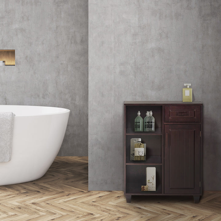 A bathroom with a dark espresso-colored Teamson Home Catalina Single Door Free Standing Cabinet with Open Shelves and Drawer, Espresso and a bathtub.