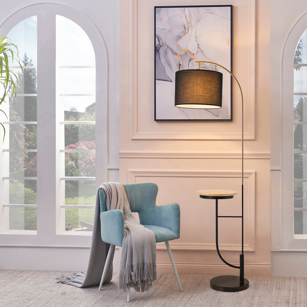 A living room with a blue chair and a Teamson Home Danna Floor Lamp with Marble Base and Built-In Table, Black