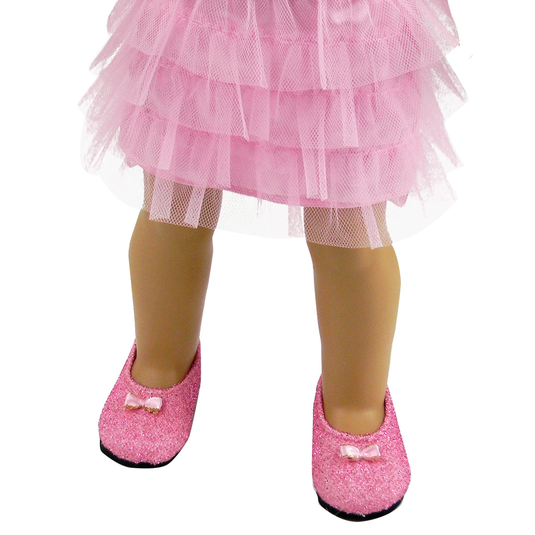 A doll wearing Sophia’s Pink Glitter Dress Shoes Accessory and tulle skirt.