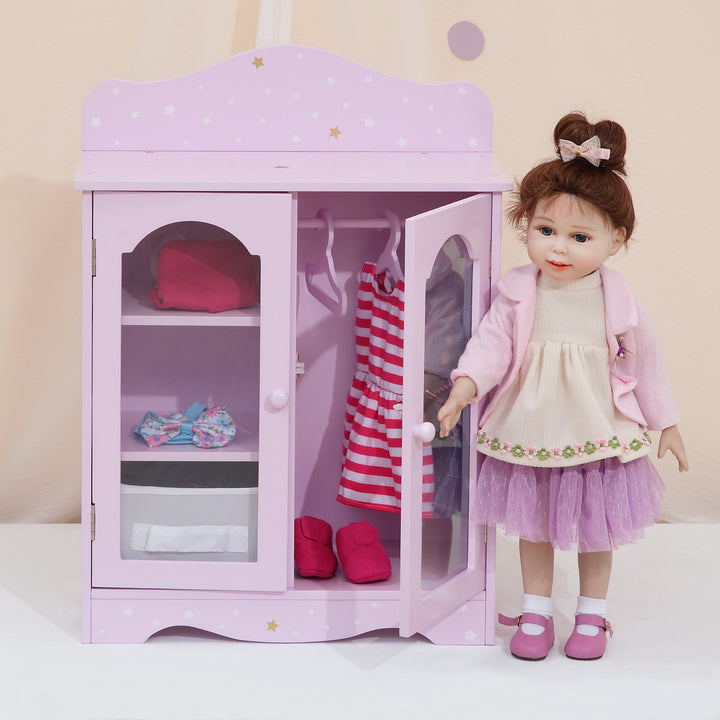An 18" doll standing next to a purple closet with white and gold stars, three shelves and three hangers. 