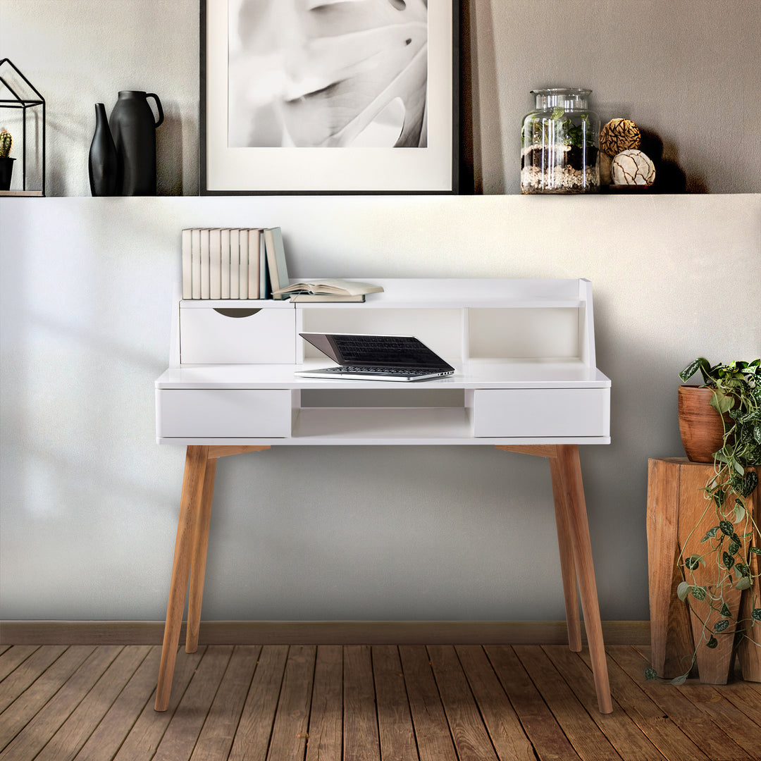 A Teamson Home Creativo Wooden Writing Desk with Storage, White/Natural with a laptop on top of it.