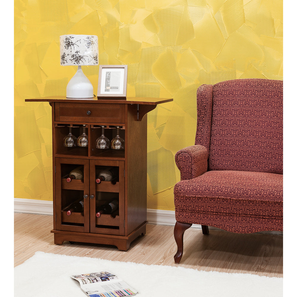 A cozy corner featuring a Teamson Home Peoria Wine Cabinet, Brown with a lamp and wine storage, adjacent to an upholstered armchair against a textured yellow wall.