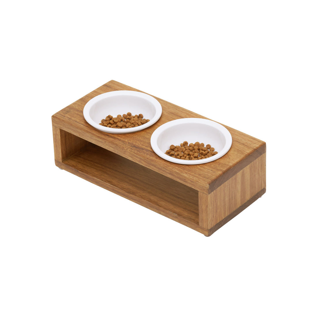 Two white ceramic bowls with kibble in a raised pet feeder.