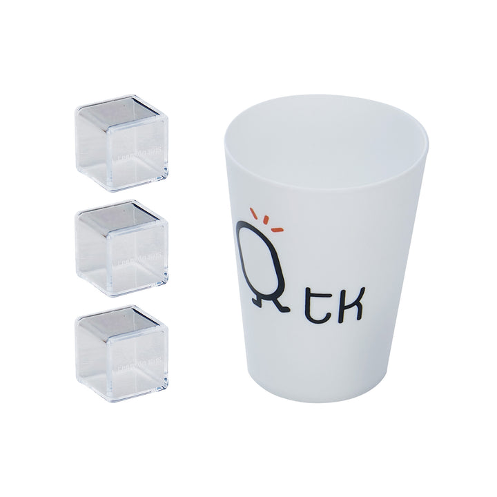 White cup with TK design accompanied by three clear square ice cubes