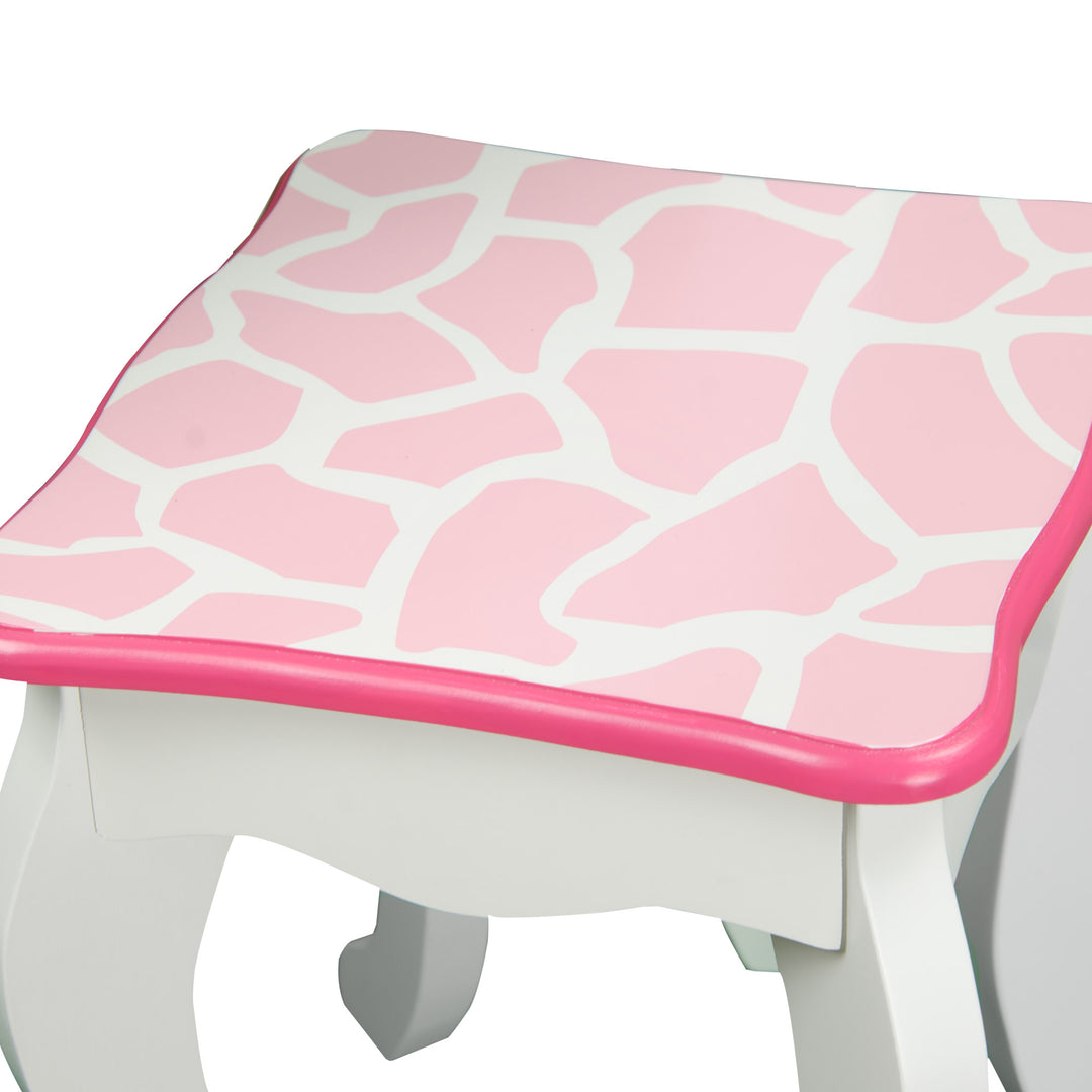 A pink and white Fantasy Fields Gisele Giraffe Prints Play Vanity Set, Pink/White stool with giraffe print.