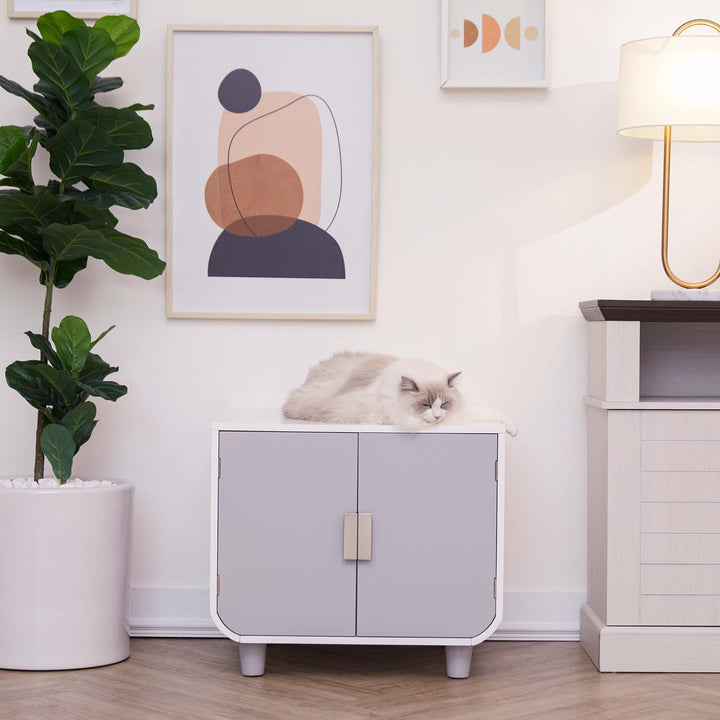 Teamson Pets Dyad Wooden Cat Litter Box Enclosure and Side Table, Alpine White, reflects a mid-century modern style.