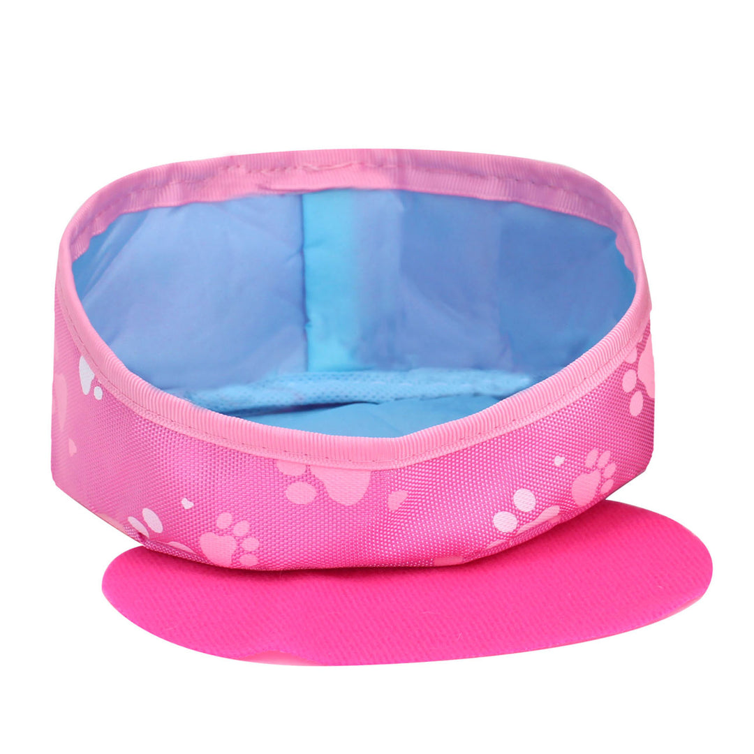 A round pink pet bed with blue interior next to a pink mat that fits inside or can be used outside of the bed.