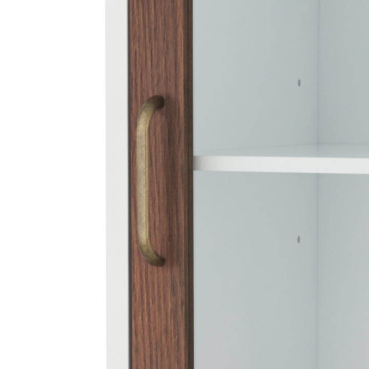 Close-up of the brass pull handle on the Teamson Home Tyler Modern Linen Storage Cabinet with Two Doors, Walnut/White