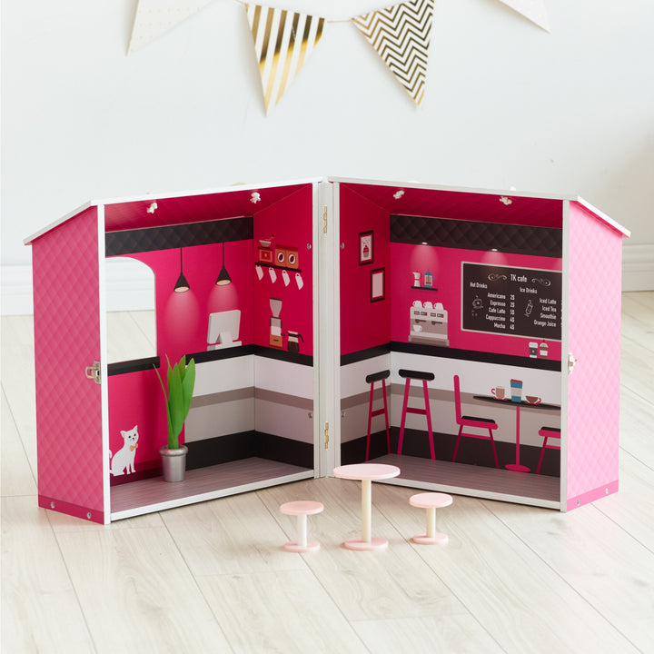 A Olivia's Little World Dreamland City Café Dollhouse, Pink and black with accessories.